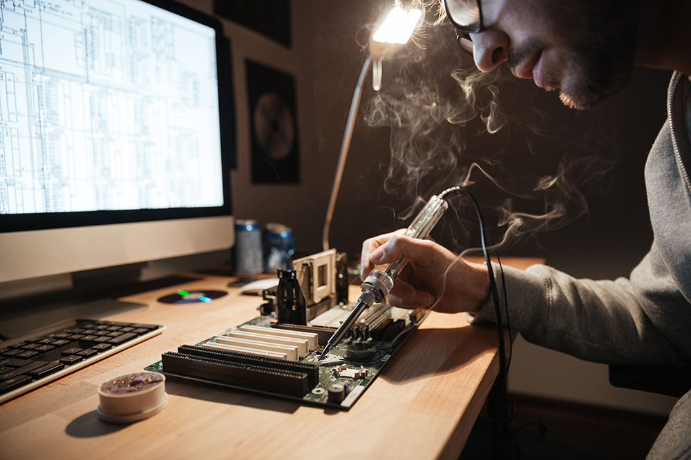 A man soldering.