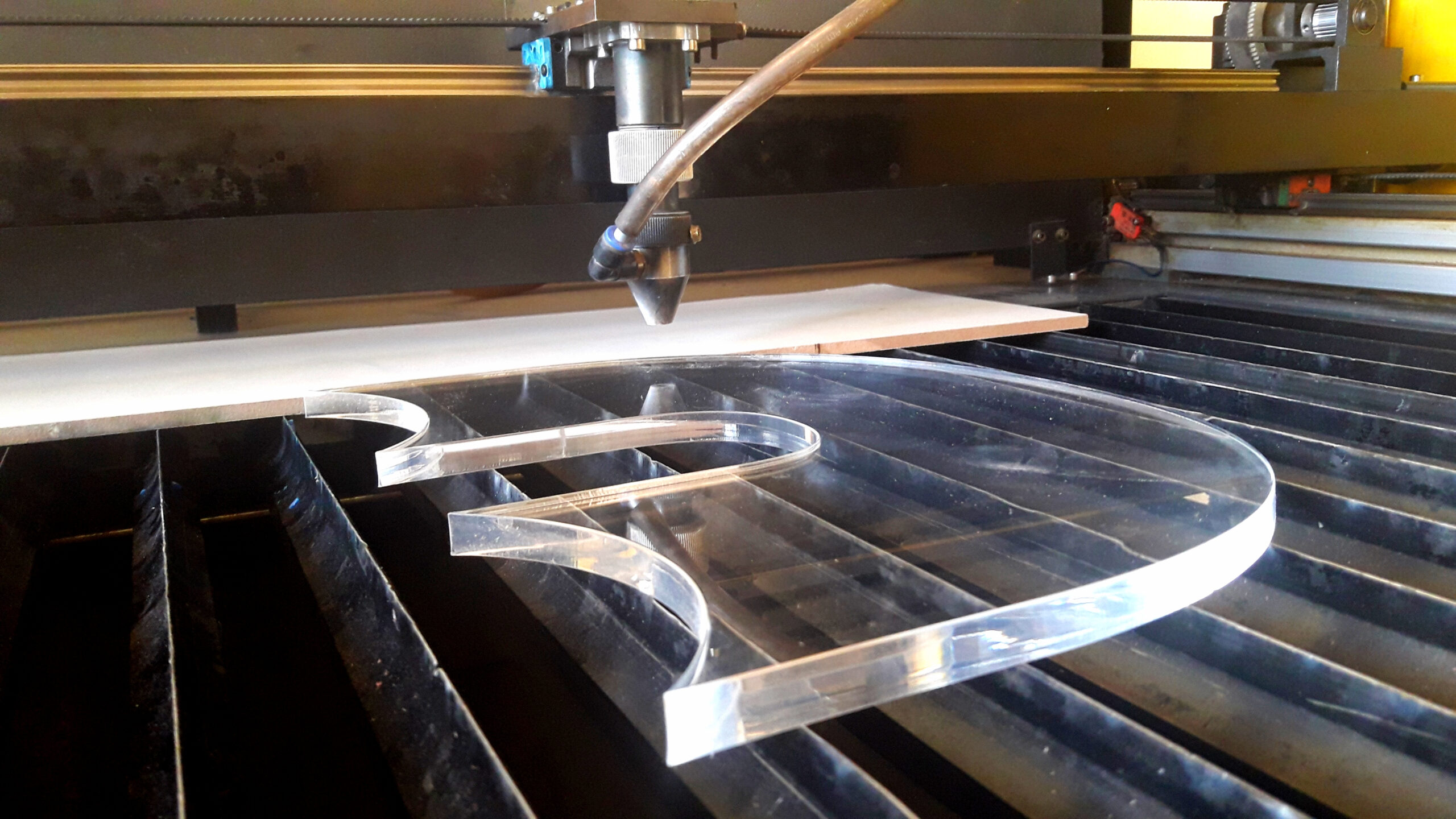 A CO2 laser machine cutting acrylic