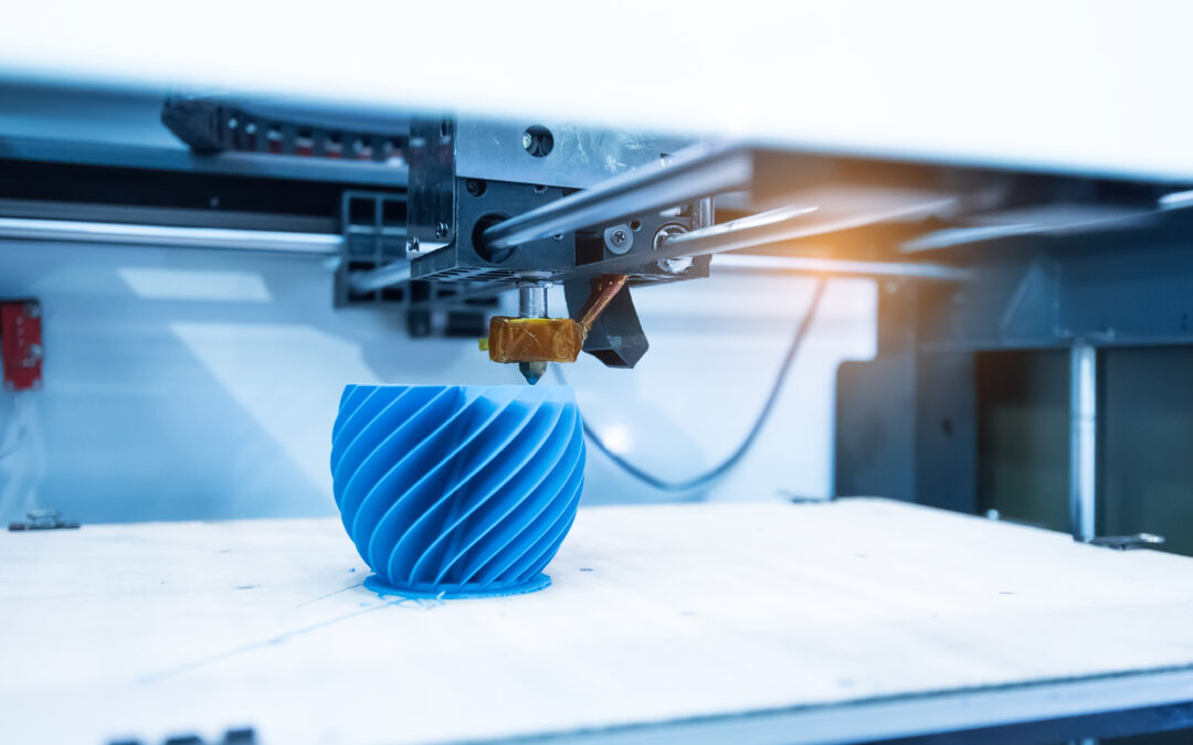 A 3D printer creating a blue vase