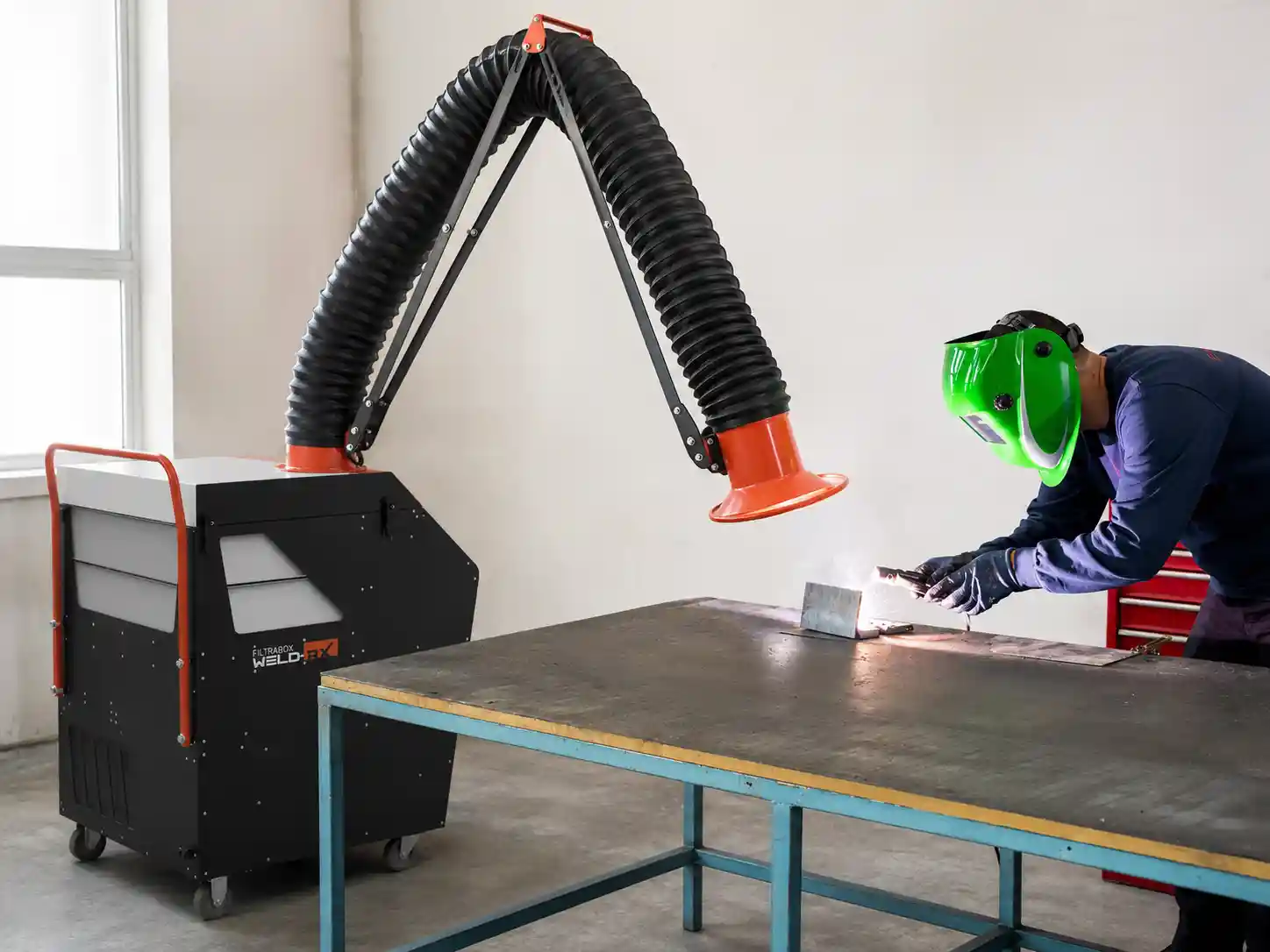 Laser welding with a Filtrabox Weld-RX laser welding fume extractor capturing fumes at the source